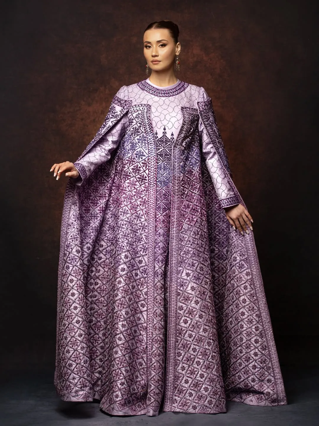 Full-length lavender couture gown with embroidered cape wings